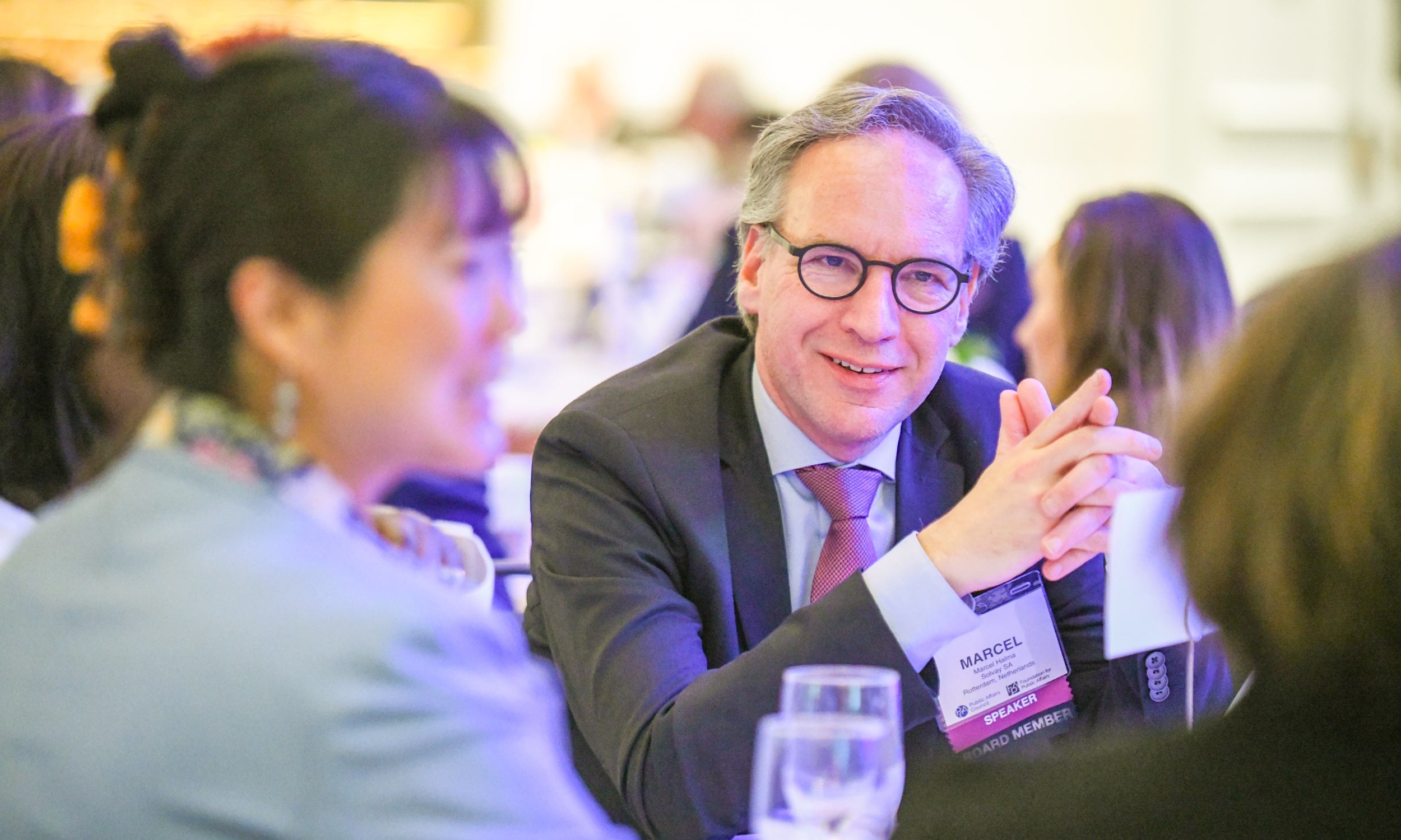 Council members in conversation at a reception