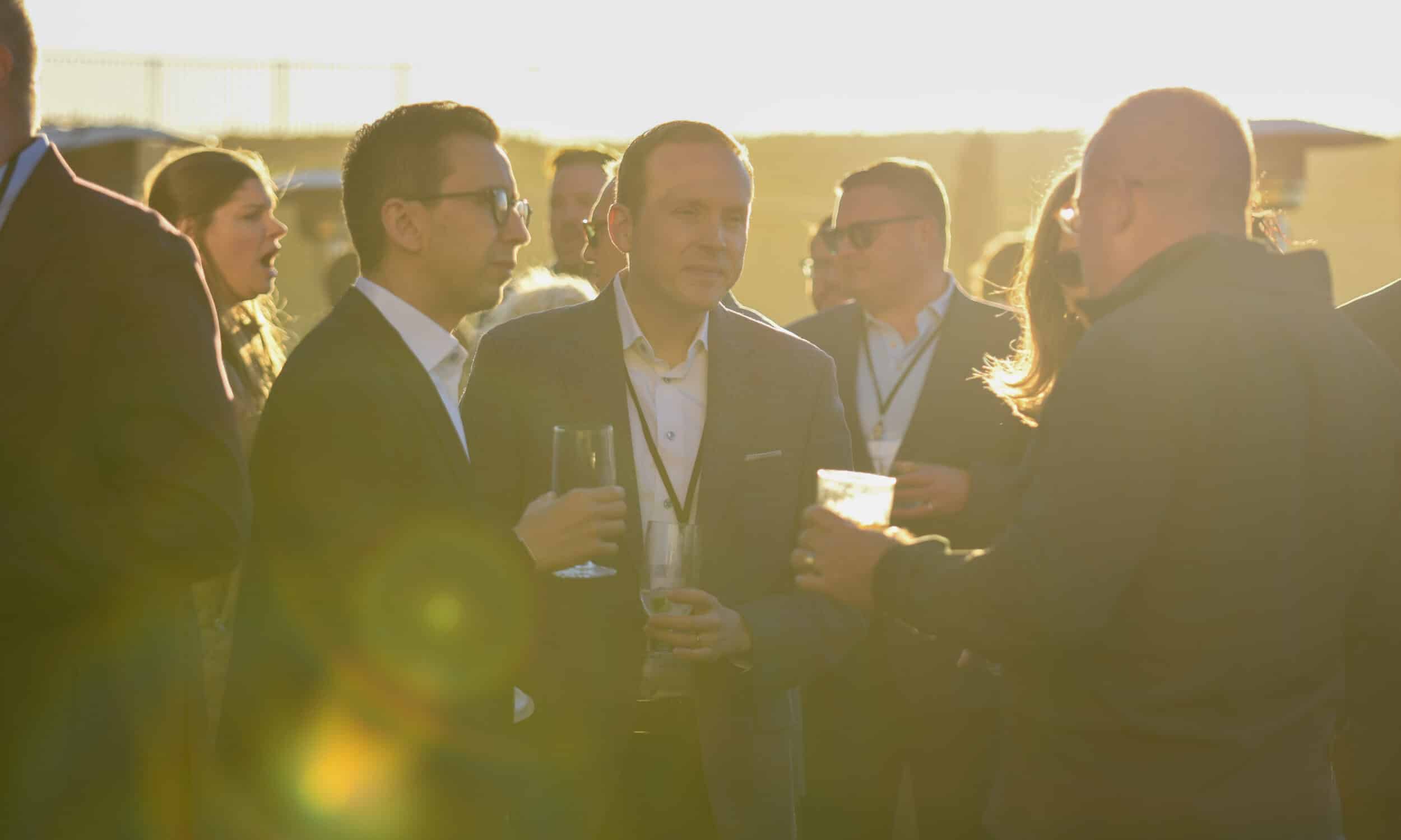 Council members in conversation at a reception
