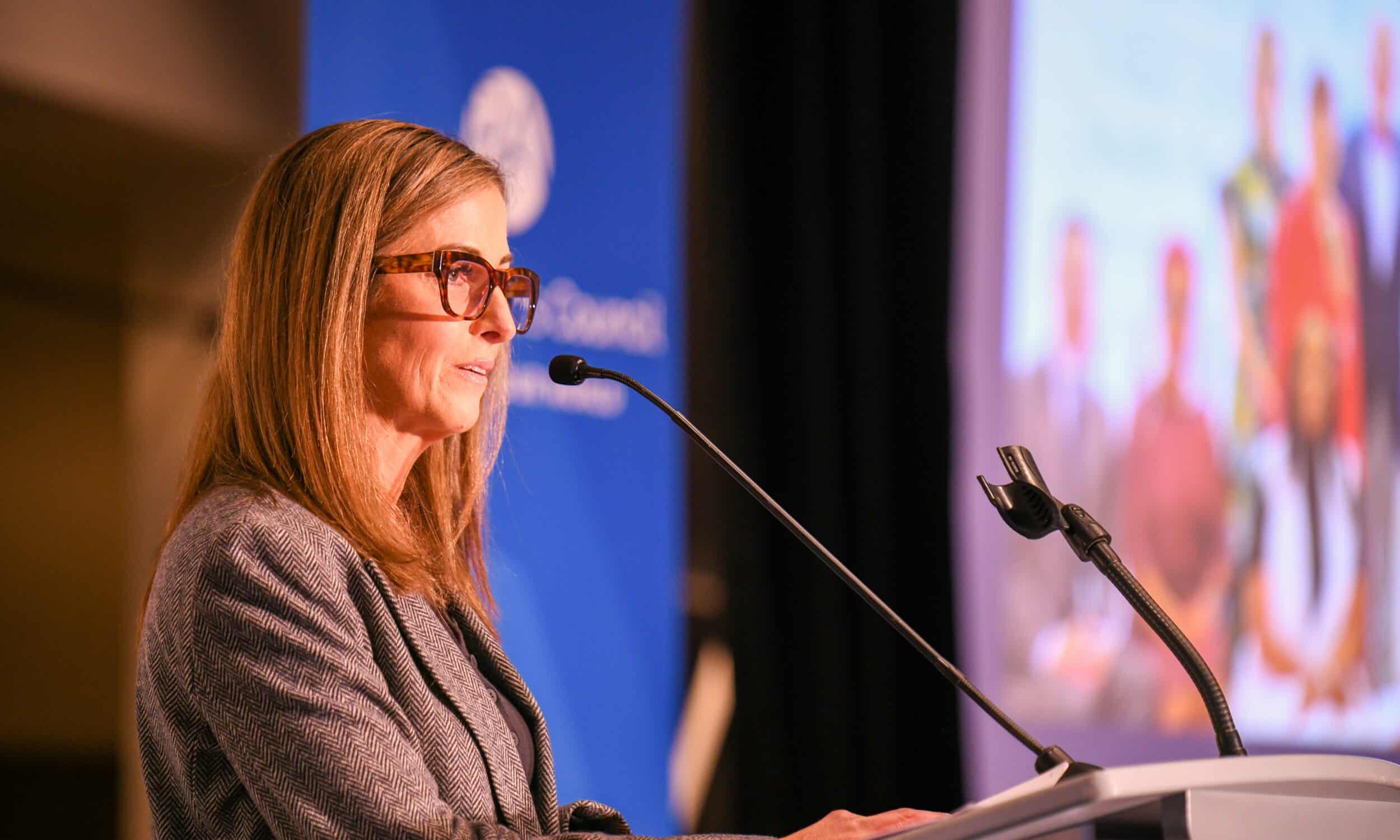 A speaker addressing the room