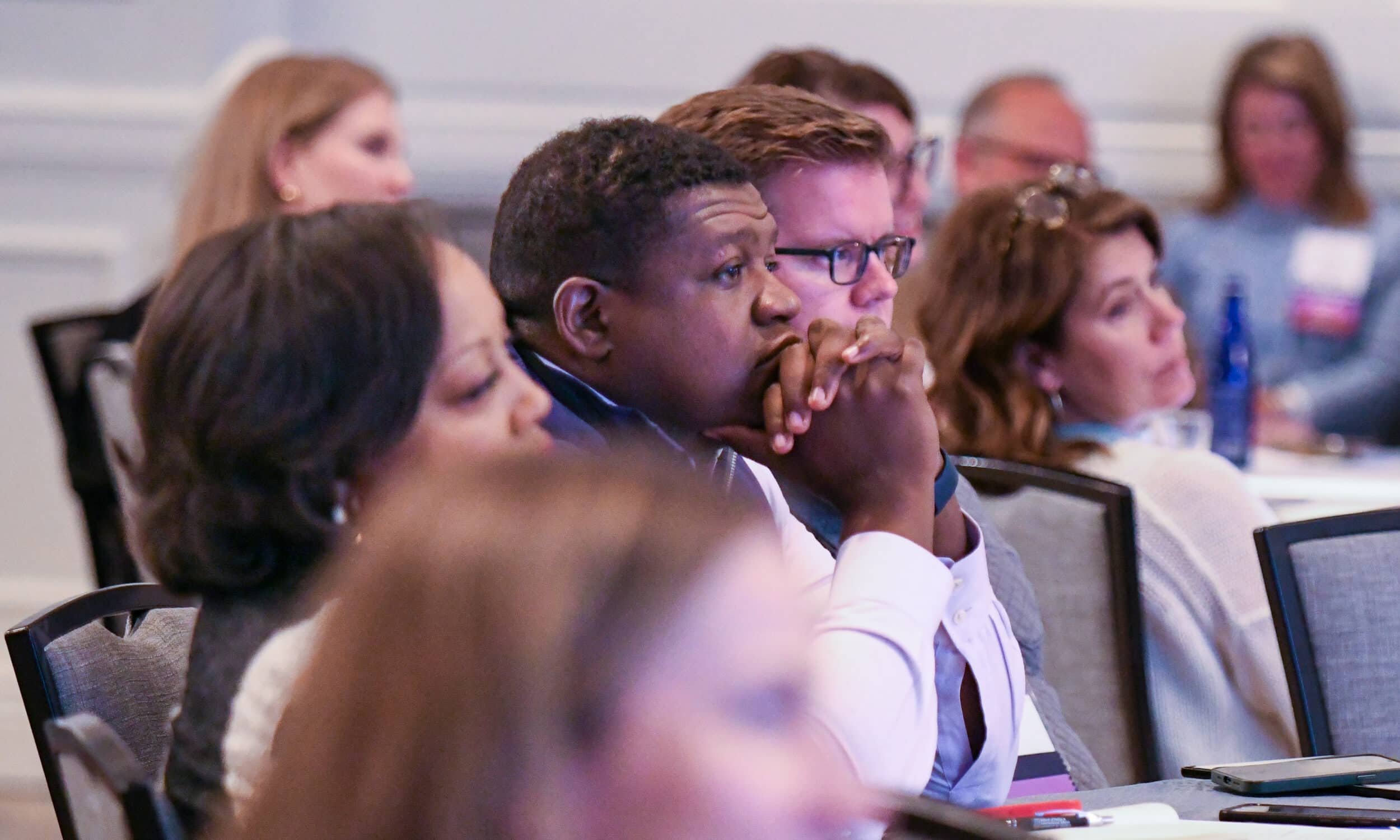 Attendees listening during a session
