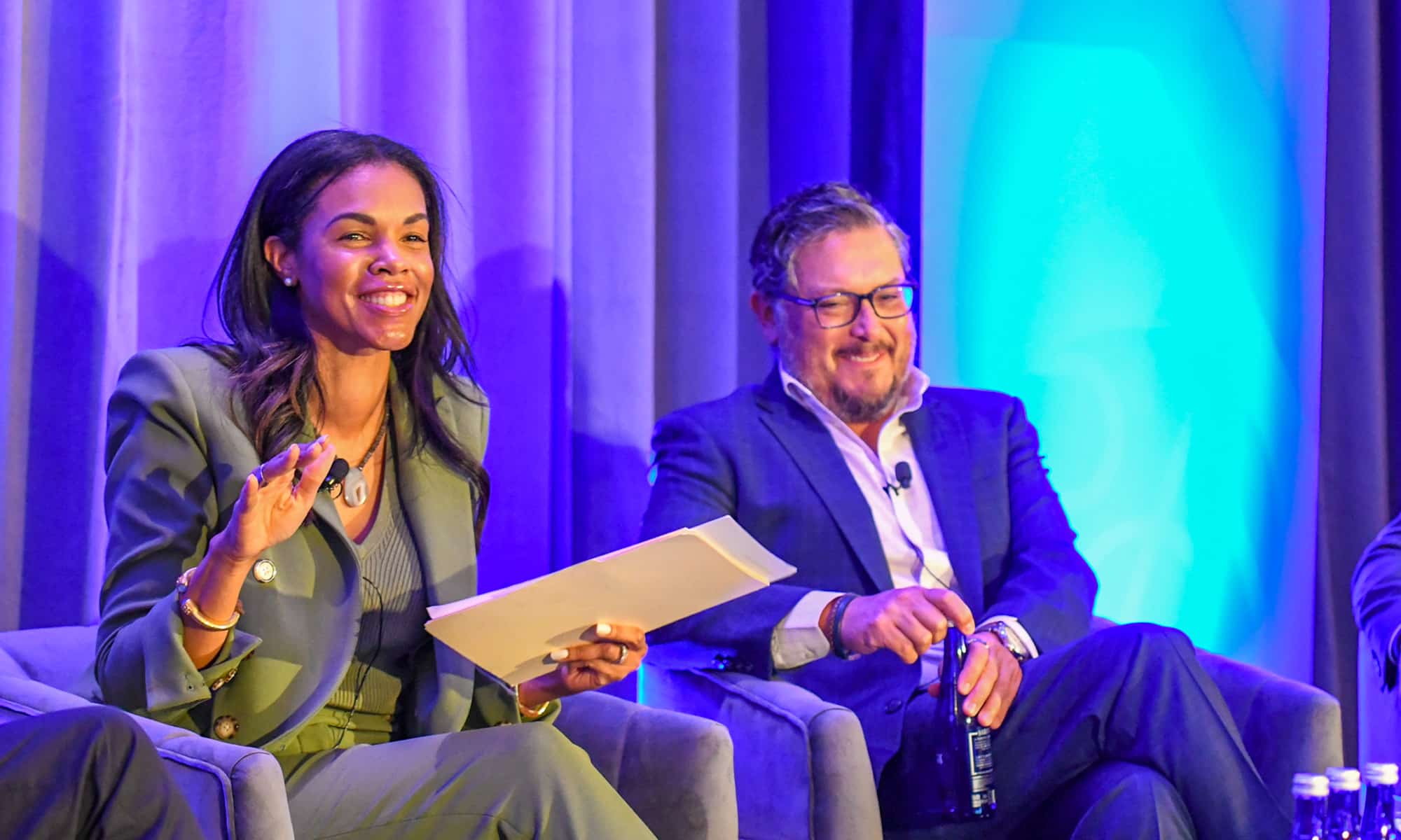 Attendees sharing a laugh during a session